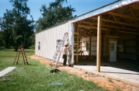 30x40x10, 20\' extended roof line, lightstone walls rustic red trim